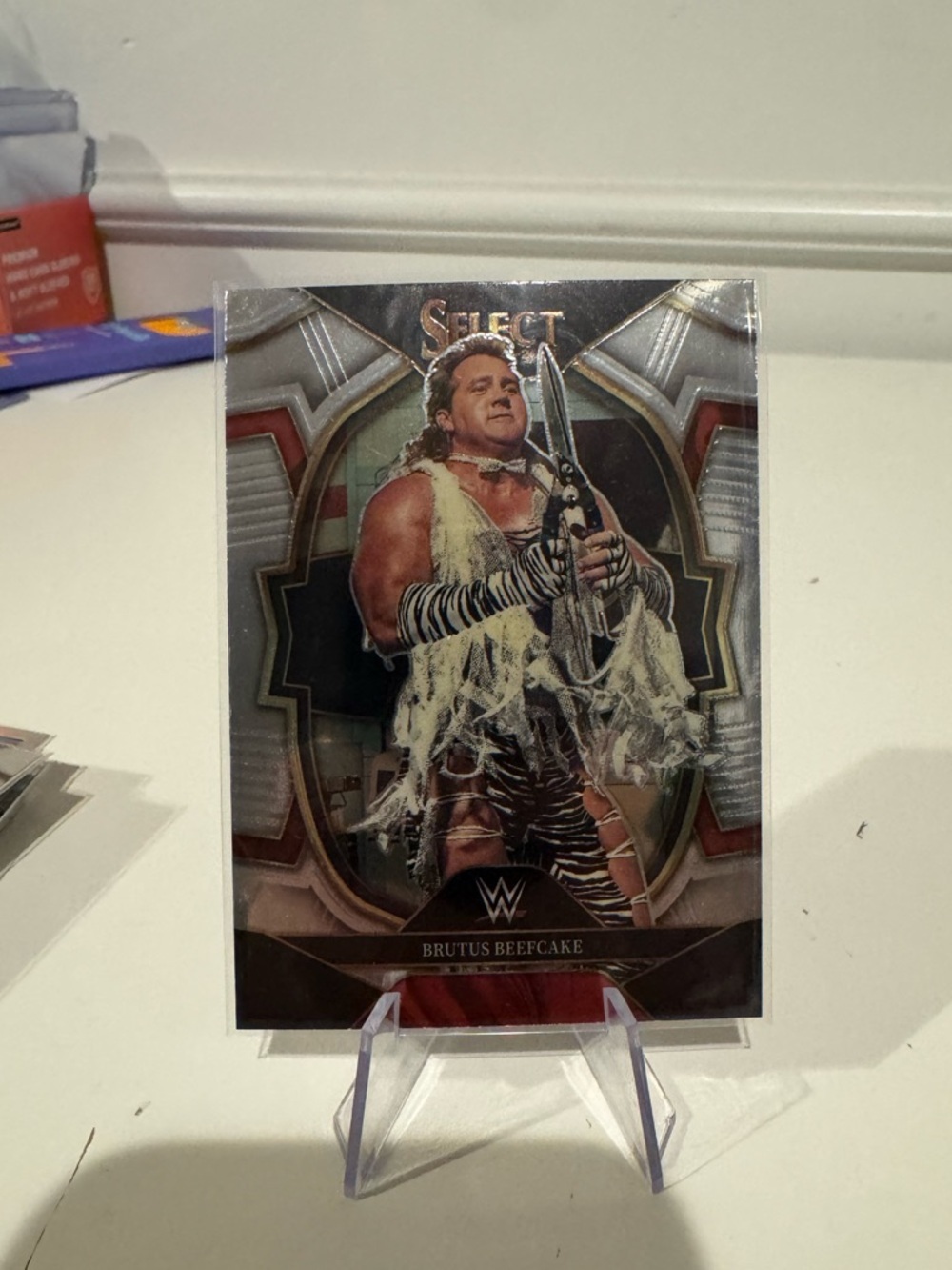 2023 Brutus “the barber” Beefcake Panini Select WWE Concourse Card.